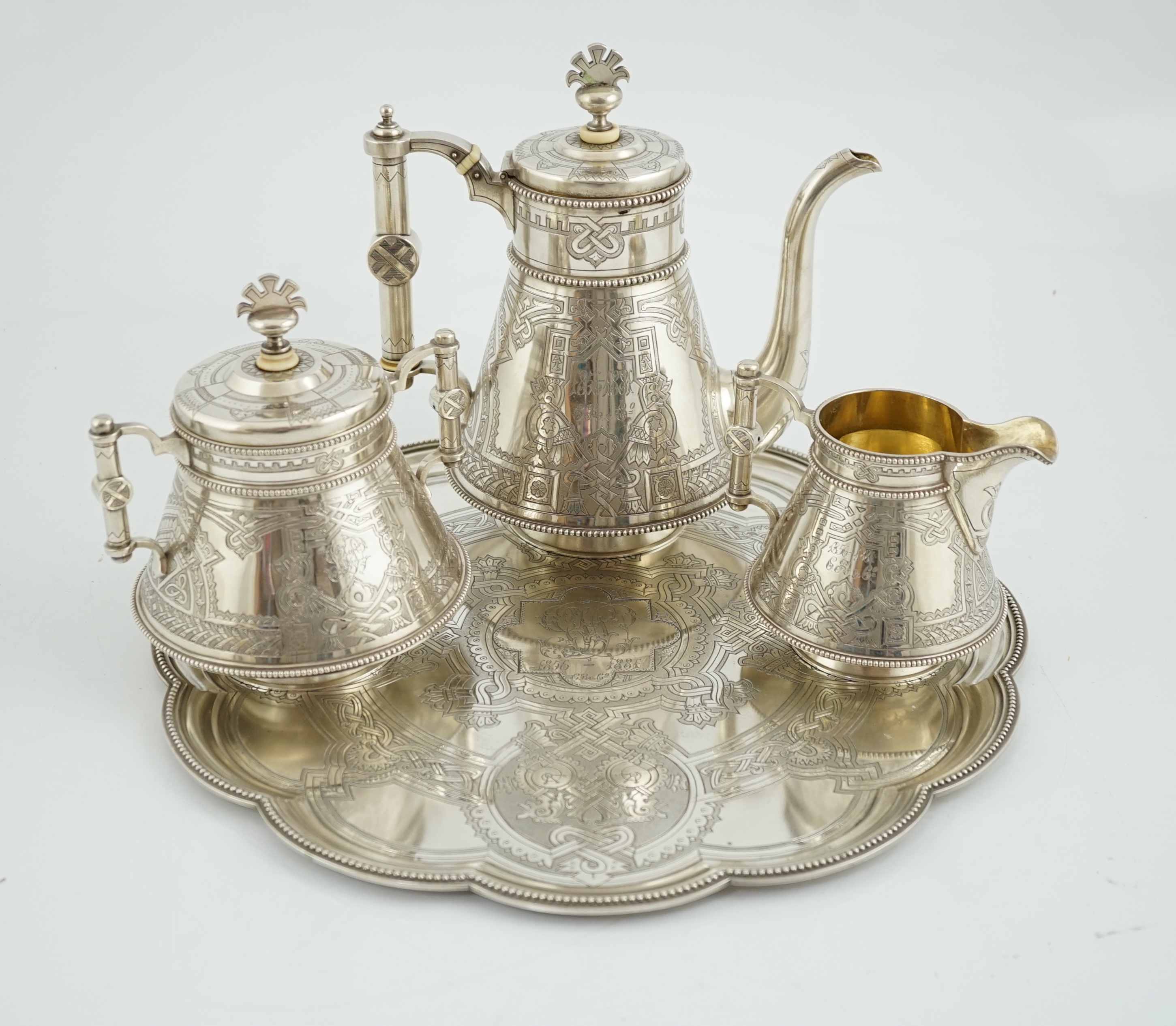 A late 19th century Russian three piece 84 zolotnik silver coffee set, with matching cusped circular tray, CITES submission reference: 6NJYTYTT